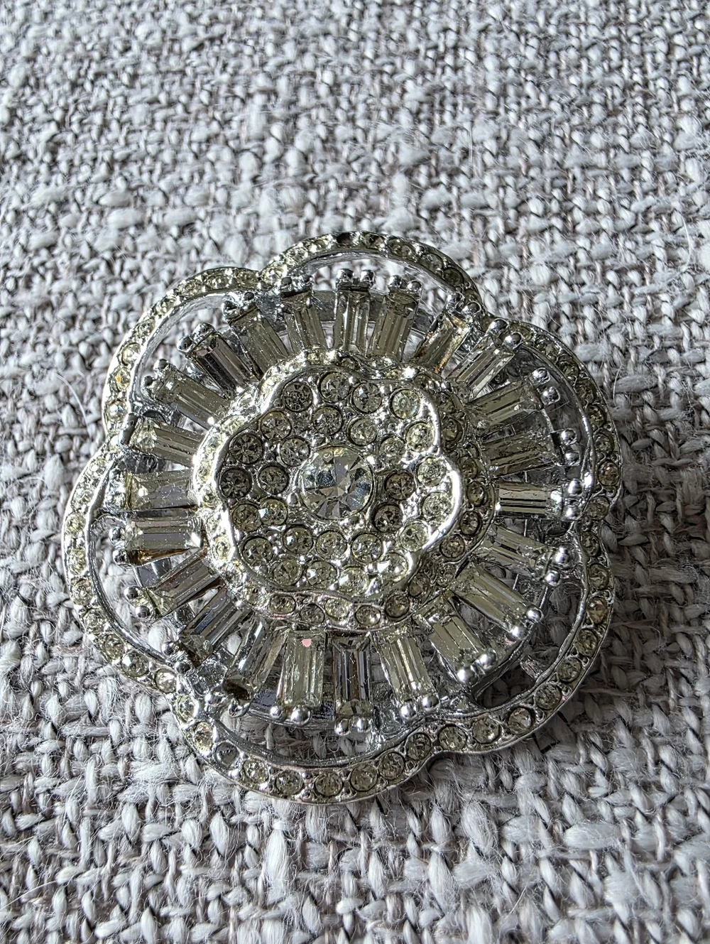 Vintage rhinestone brooch circular, tiered design with clear faceted rhinestones